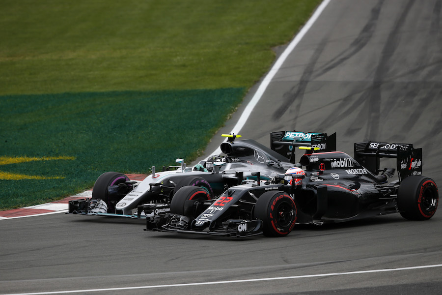 Nico Rosberg and Fernando Alonso battle for a position
