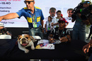 Lewis Hamilton with his dog at the autograph session 