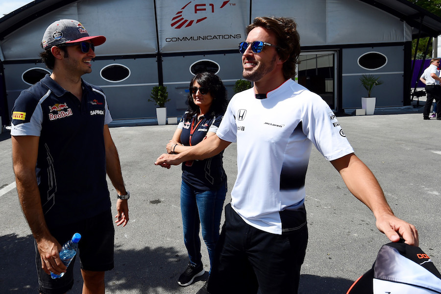 Fernando Alonso talks with Carlos Sainz