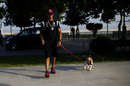Lewis Hamilton through the paddock with his dog
