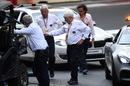 Charlie Whiting inspect the track after FP1 