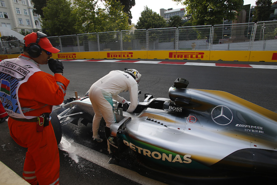 Lewis Hamilton leaves his car after crashed in Q3