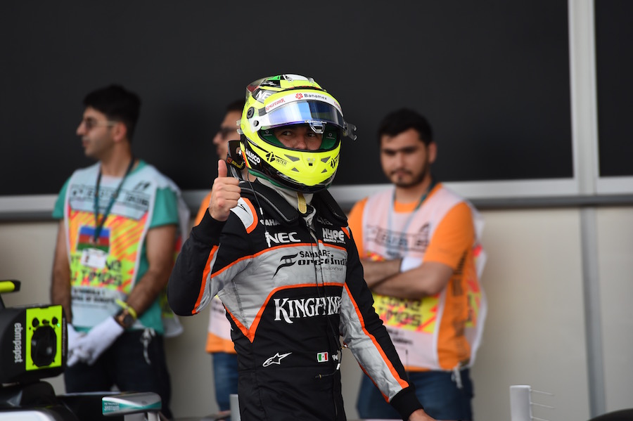 Sergio Perez poses in parc ferme after qualifying second