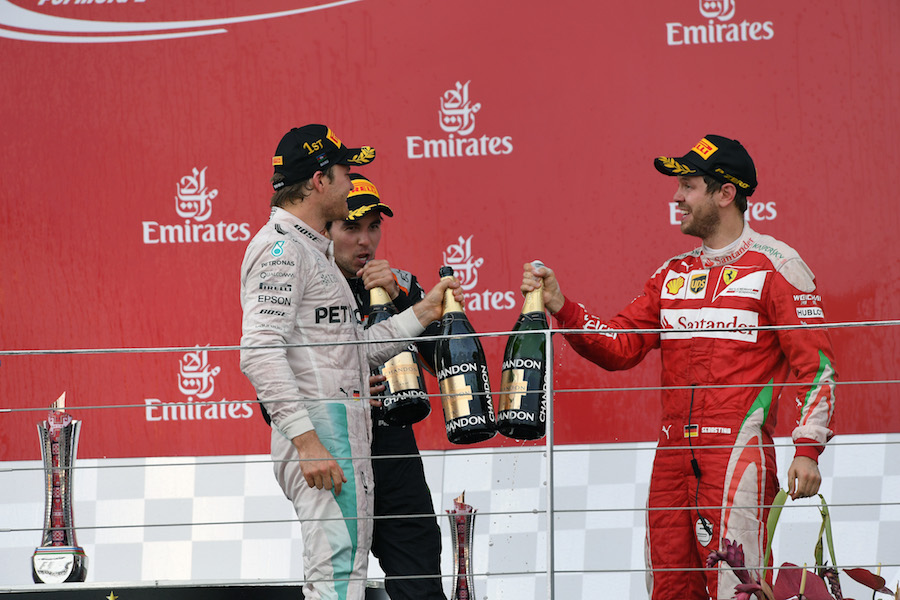 Nico Rosberg and Sebastian Vettel celebrate on the podium