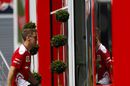 Sebastian Vettel walks into the Ferrari motor home