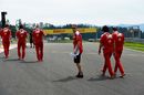 Sebastian Vettel walks the grid with his engineers