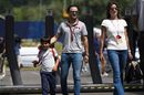 Felipe Massa arrives the paddock with his wife Rafaela Bassi and son Felipinho Massa