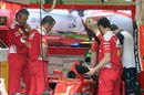 Ferrari mechanics prepare SF16-H with halo device
