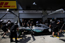 Lewis Hamilton returns to the pitbox