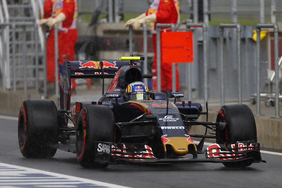 Carlos Sainz returns to pit in heavy rain
