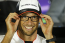 Jenson Button wears glasses in the press conference