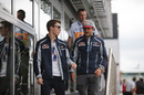 Carlos Sainz and Daniil Kyvat walk through the paddock