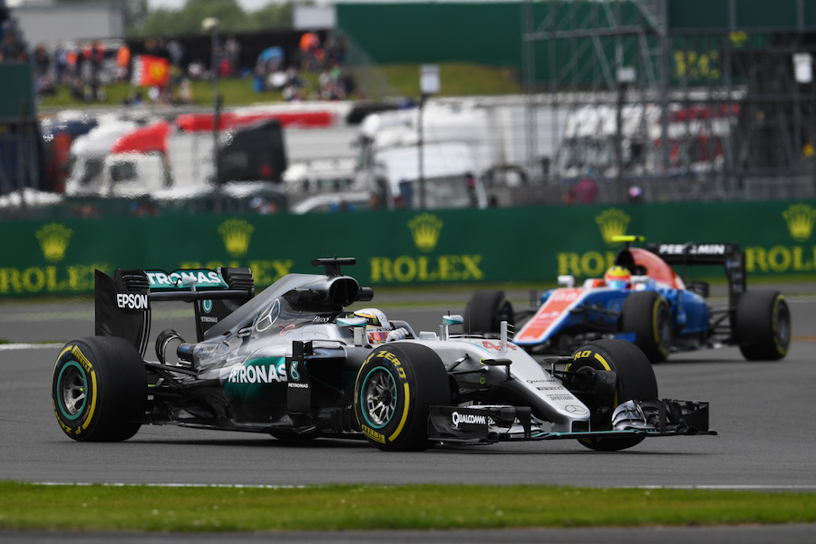 Lewis Hamilton rides a kerb in the Mercedes