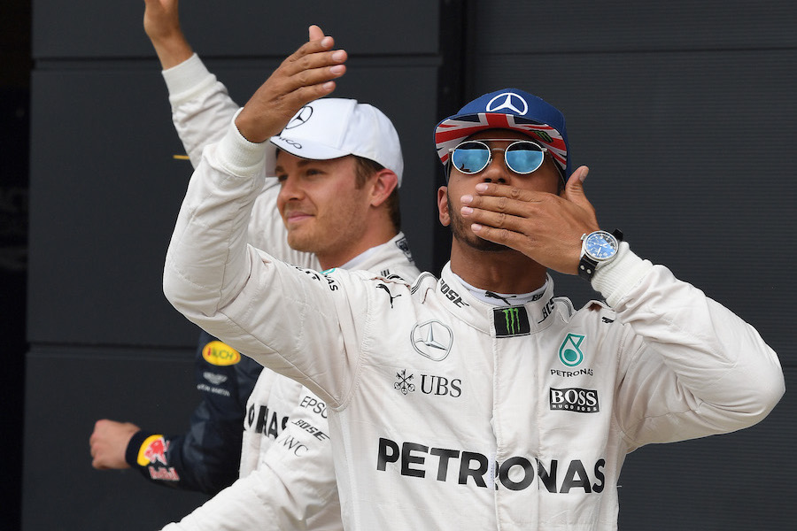 Lewis Hamilton celebrates his pole in parc ferme