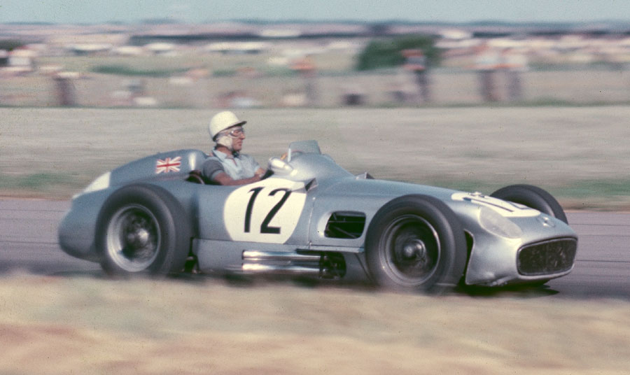 Stirling Moss guides his Mercedes to victory
