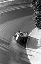 Juan Manuel Fangio drifts his Ferrari through Mirabeau