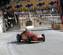 Juan Manuel Fangio holds on to a huge slide coming out of Tabac