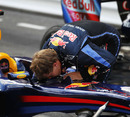 Sebastian Vettel checks his car following the Monaco Grand Prix