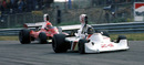 James Hunt leads Niki Lauda on the way to his maiden victory