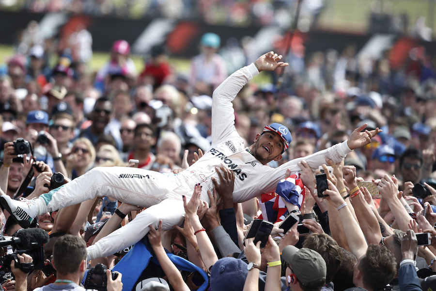 Lewis Hamilton celebrates with the fans