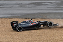 Fernando Alonso spins into the gravel