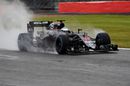 Fernando Alonso on wet track in the McLaren