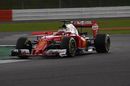 Kimi Raikkonen on track in the Ferrari with puttting soft tyres