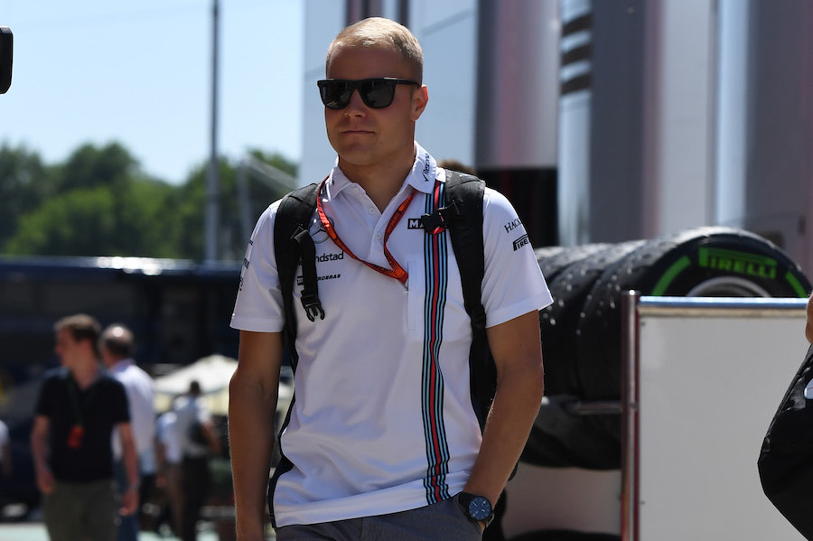 Valtteri Bottas walks through the paddock