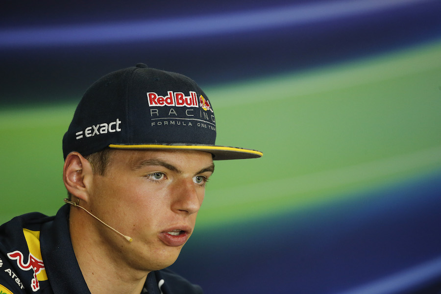 Max Verstappen looks on in the press conference
