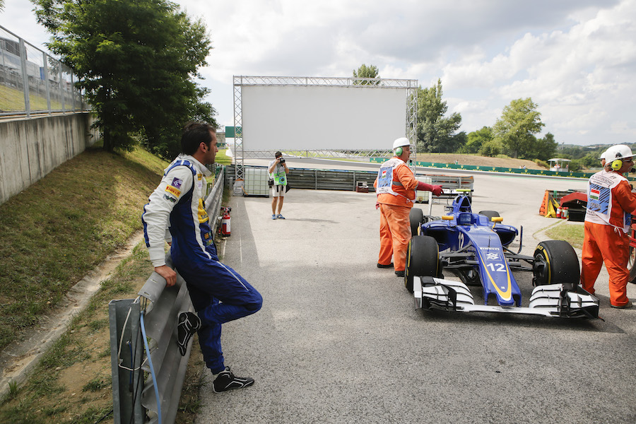 Felipe Nasr's car is recovered to the pit