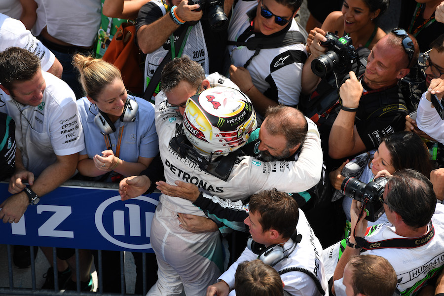 Lewis Hamilton celebrates with his team in parc ferme