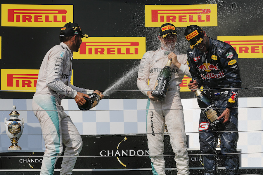Top 3 drivers celebrate with champagne