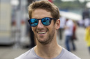 Romain Grosjean arrives the paddock with a smile on his face