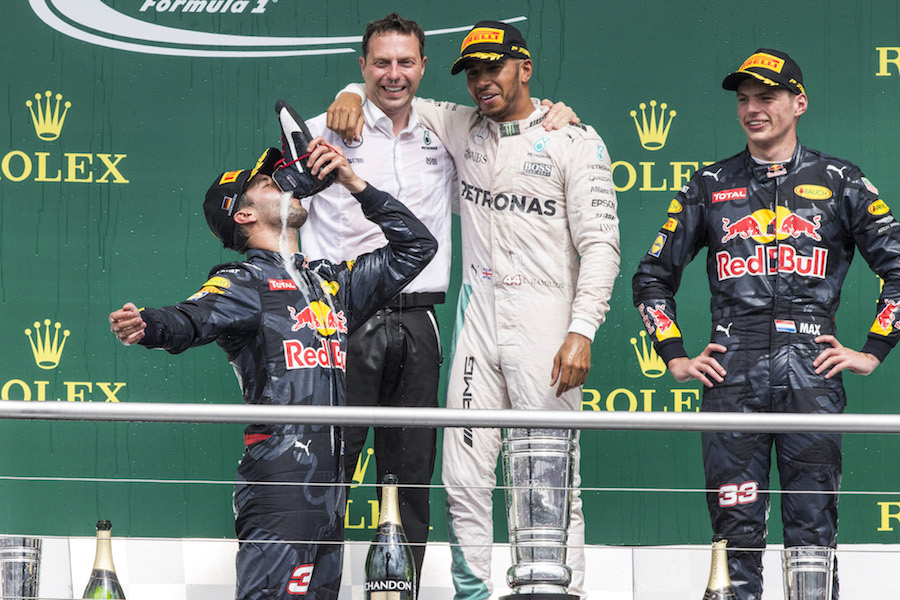 Daniel Ricciardo drinks champagne from his race boot