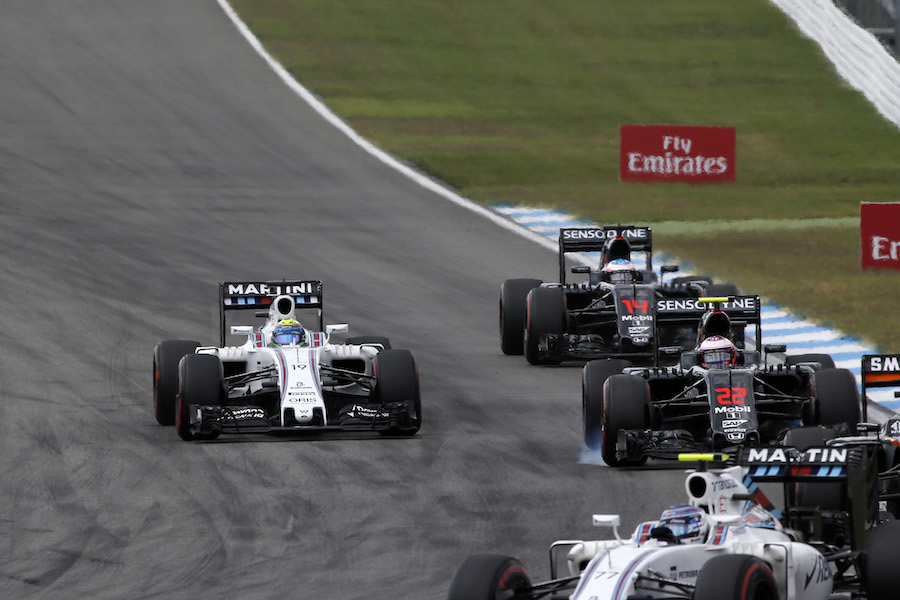 Jenson Button and Felipe Massa battle for a position