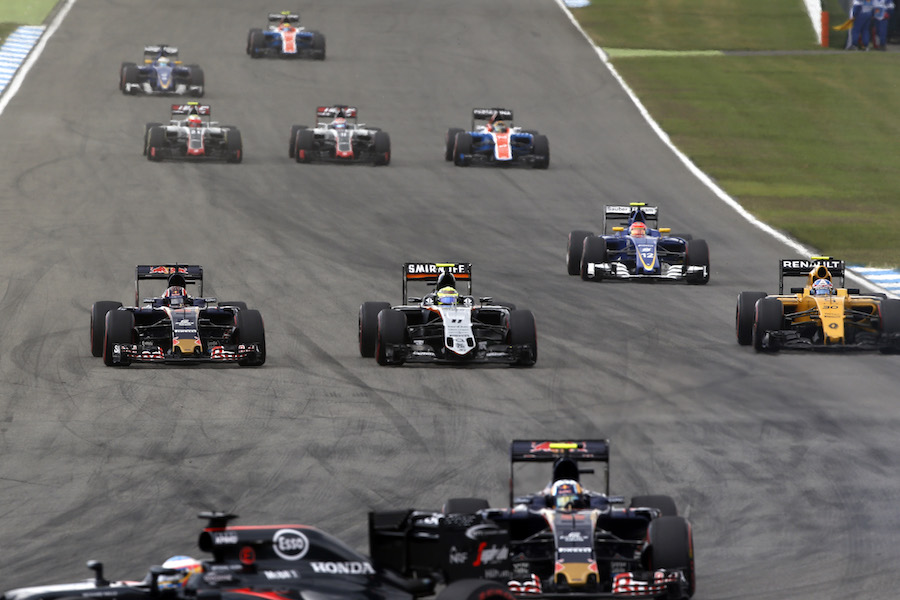 Daniil Kvyat and Sergio Perez battle for a position at the start of the race