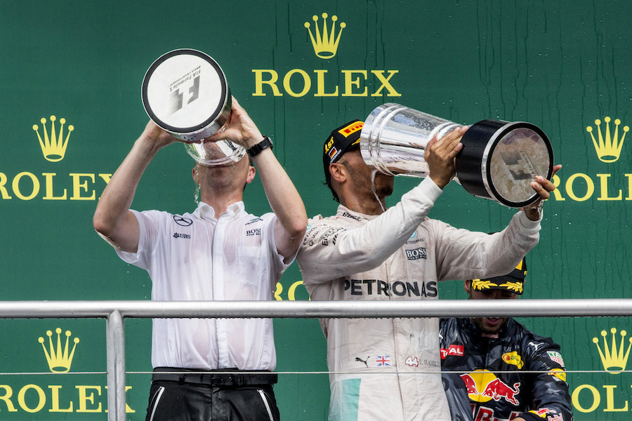 Lewis Hamilton celebrates his win with the champagne