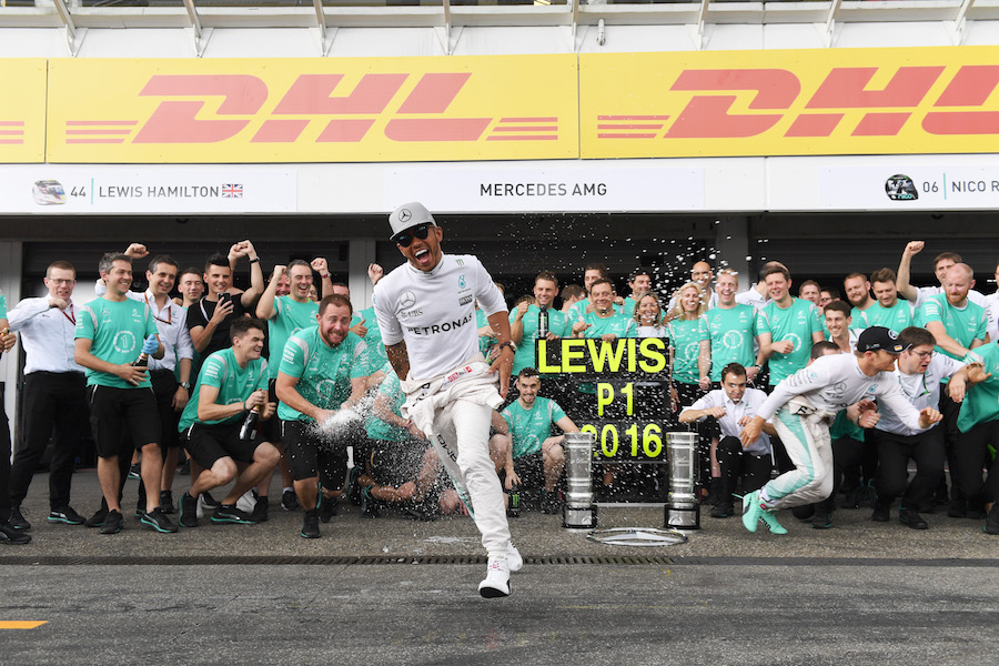 Lewis Hamilton celebrates his win with the team
