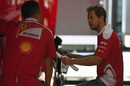 Sebastian Vettel discuss something with Ferrari engineer