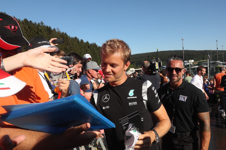 Nico Rosberg signs autographs for fans