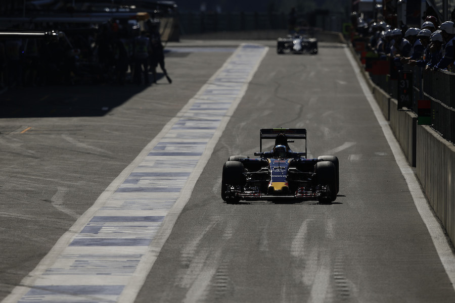 Carlos Sainz makes his way down the pit lane