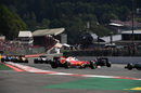 Sebastian Vettel spins after having a contact with Kimi Raikkonen