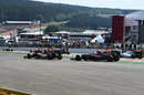 Sergio Perez and Jenson Button run wide at the start of the race