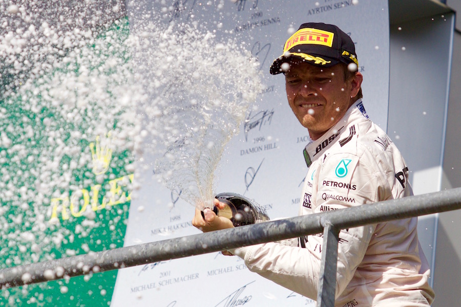 Nico Rosberg celebrates his win on the podium