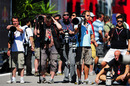 F1 photographers lined up in the paddock