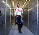 Sebastian Vettel makes his way into the Red Bull garage
