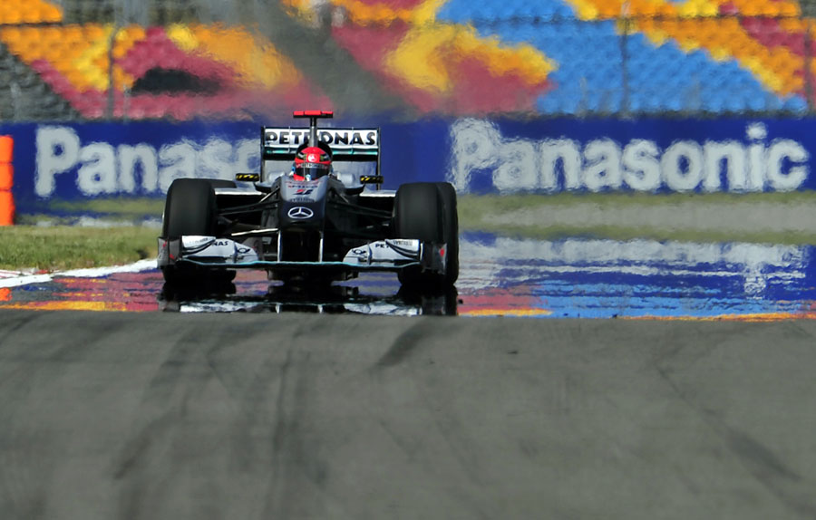 Michael Schumacher's Mercedes comes through a mirage