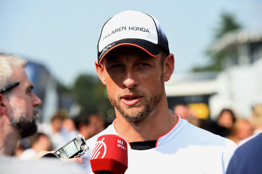 Jenson Button talks with media