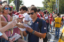 Felipe Nasr signs autographs for fans