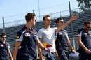 Daniil Kvyat walks the track with his engineers